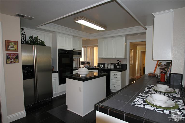 3948 Southhampton Road Moorpark, CA 93021 - Photo 4 of 30 a kitchen with a refrigerator and a stove