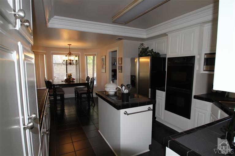 3948 Southhampton Road Moorpark, CA 93021 - Photo 5 of 30 a kitchen with a refrigerator and a sink