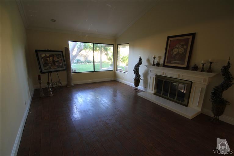 3948 Southhampton Road Moorpark, CA 93021 - Photo 8 of 30 a view of empty room with wooden floor and fireplace
