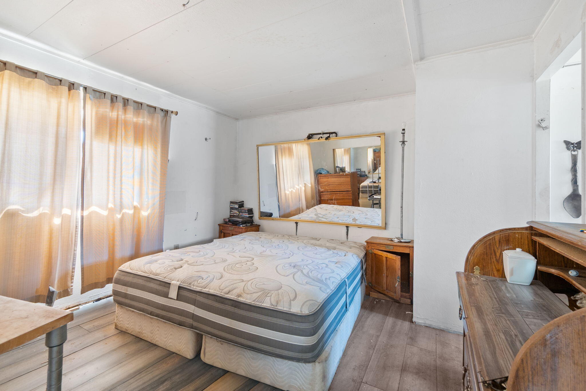 13957 Gas Point Road Igo, CA 96047 - Photo 7 of 18 a bedroom with a bed and window