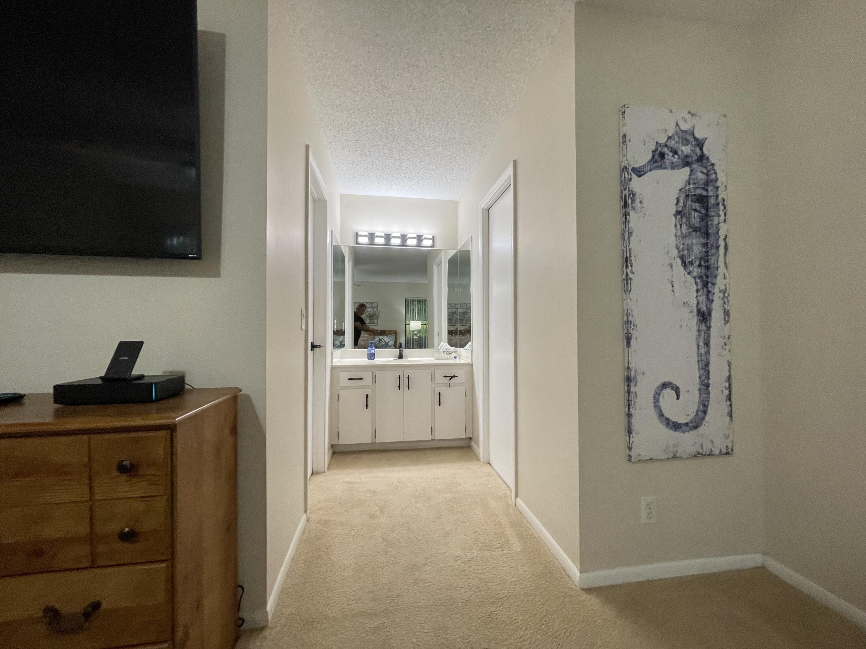 354 Southwest 28th Avenue Delray Beach, FL 33445 - Photo 19 of 54 a en suite bathroom with a granite countertop sink a mirror and shower
