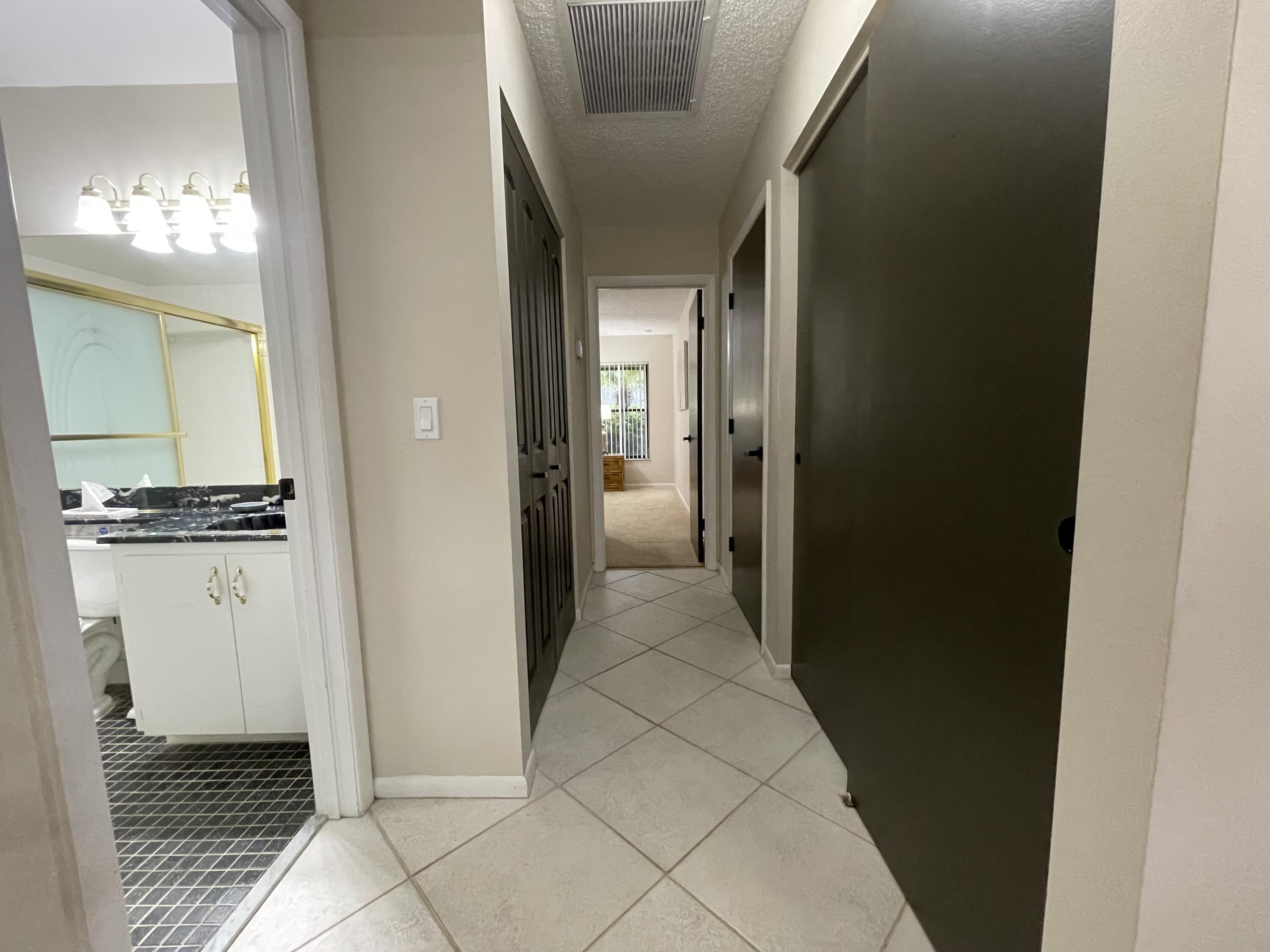 354 Southwest 28th Avenue Delray Beach, FL 33445 - Photo 23 of 54 a view of a hallway view with wooden floor and a living room