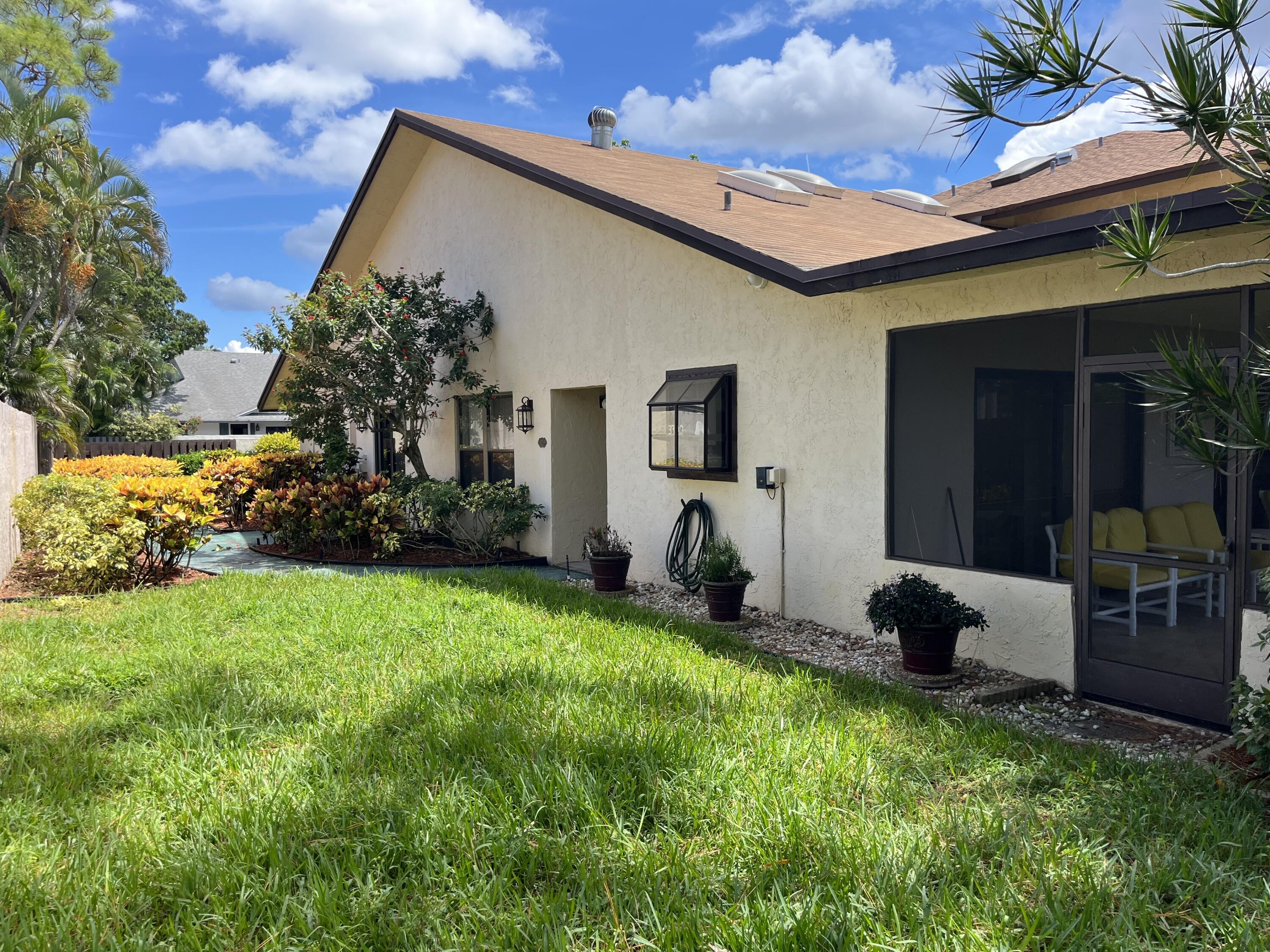 354 Southwest 28th Avenue Delray Beach, FL 33445 - Photo 39 of 54 a view of a house with backyard and sitting area
