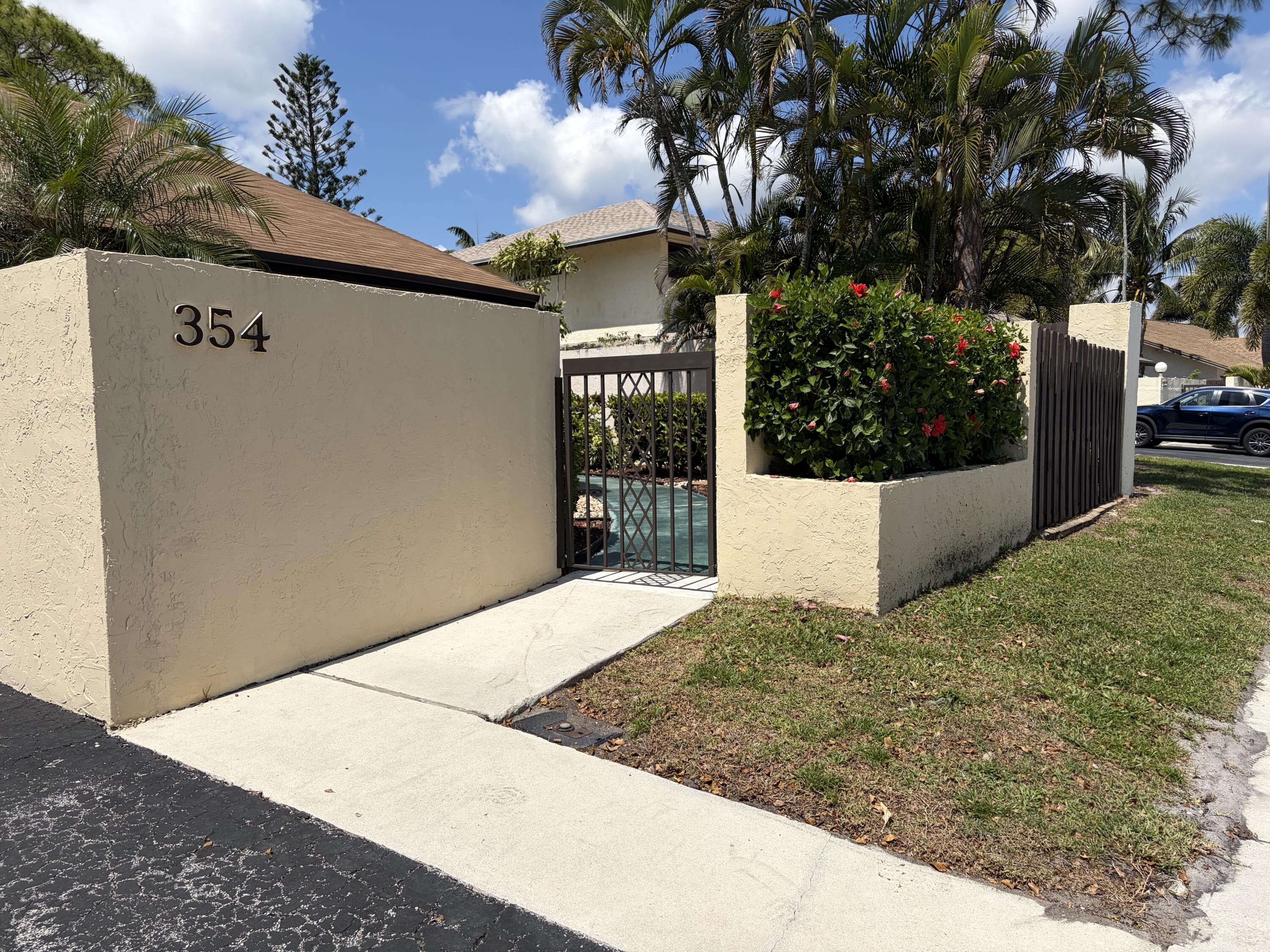 354 Southwest 28th Avenue Delray Beach, FL 33445 - Photo 45 of 54 a view of an entrance of the house