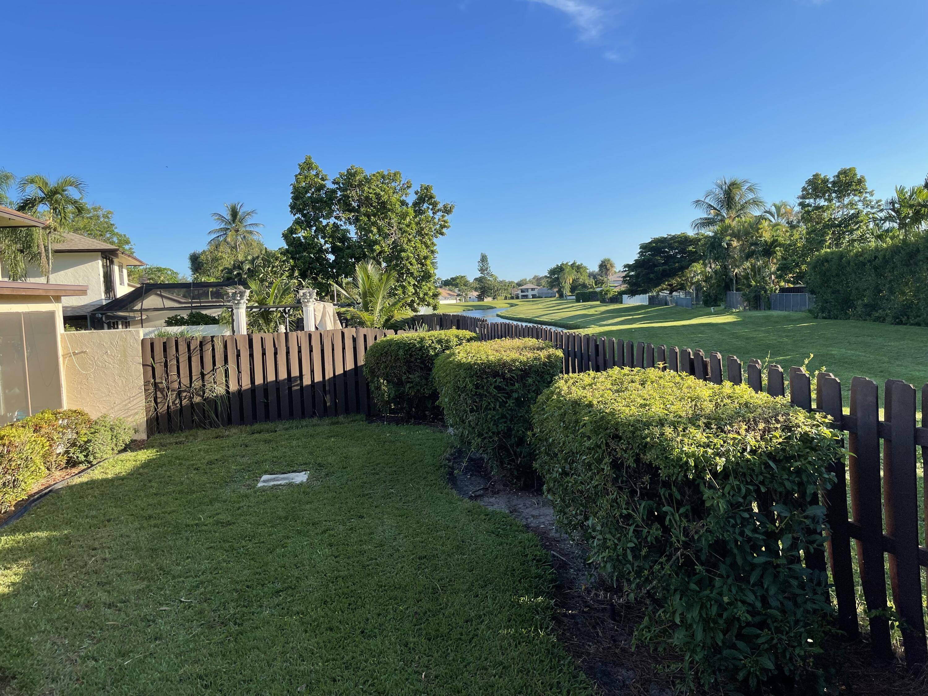 354 Southwest 28th Avenue Delray Beach, FL 33445 - Photo 48 of 54 a view of a garden with lake