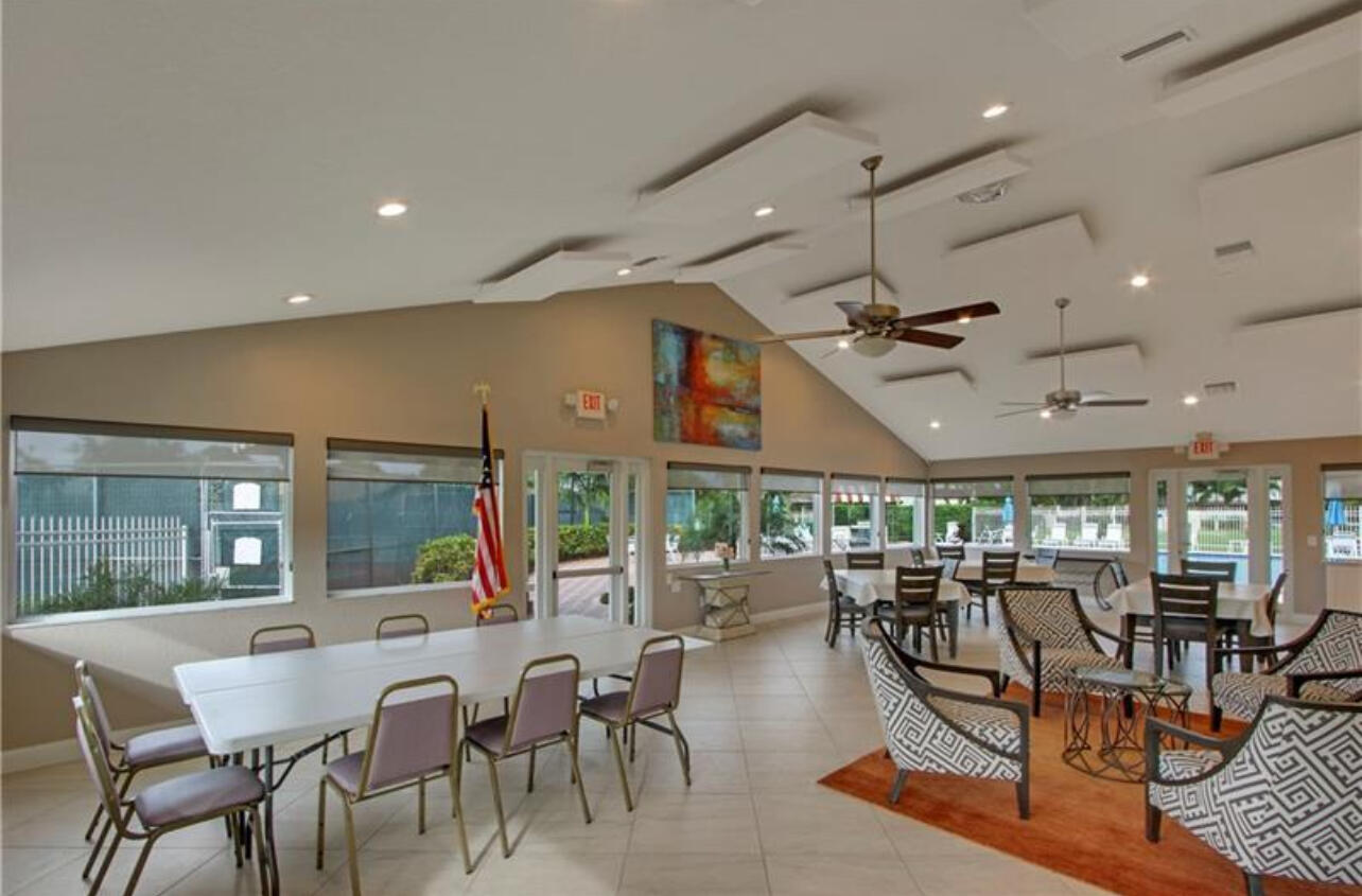 354 Southwest 28th Avenue Delray Beach, FL 33445 - Photo 50 of 54 a dining room with lots of tables a glass table and chairs
