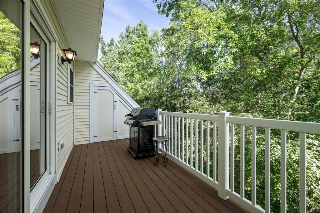 35 Collins Street, Unit 73 Danvers, MA 01923 - Photo 13 of 30 a view of balcony with wooden floor and fence