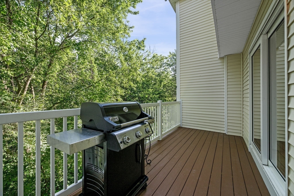 35 Collins Street, Unit 73 Danvers, MA 01923 - Photo 14 of 30 a view of a balcony with wooden floor