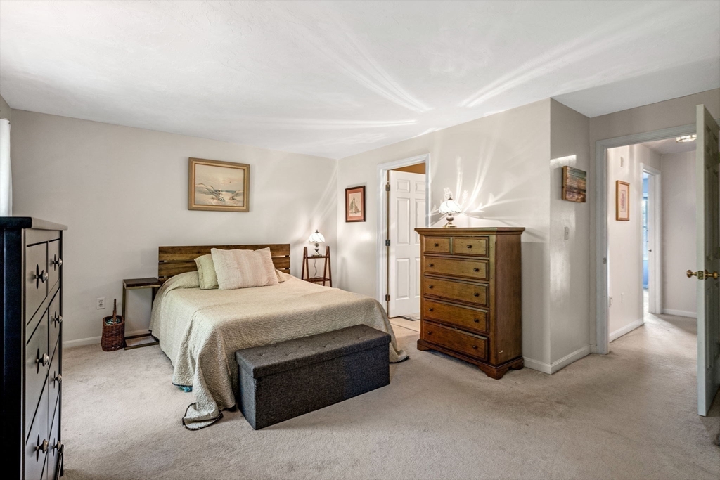 35 Collins Street, Unit 73 Danvers, MA 01923 - Photo 17 of 30 a bedroom with a bed and dresser