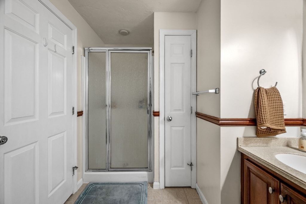 35 Collins Street, Unit 73 Danvers, MA 01923 - Photo 19 of 30 a bathroom with a sink and a mirror