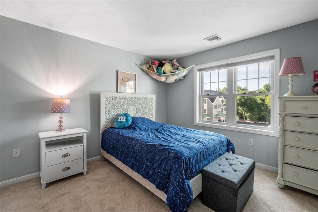 35 Collins Street, Unit 73 Danvers, MA 01923 - Photo 20 of 30 a bedroom with a bed and a window