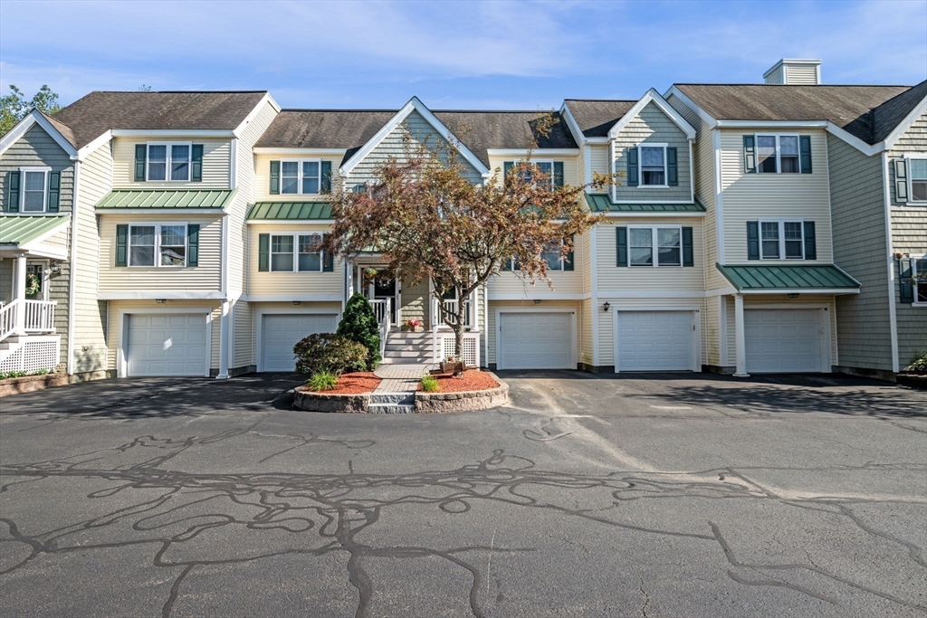 35 Collins Street, Unit 73 Danvers, MA 01923 - Photo 28 of 30 a front view of a house with a garage