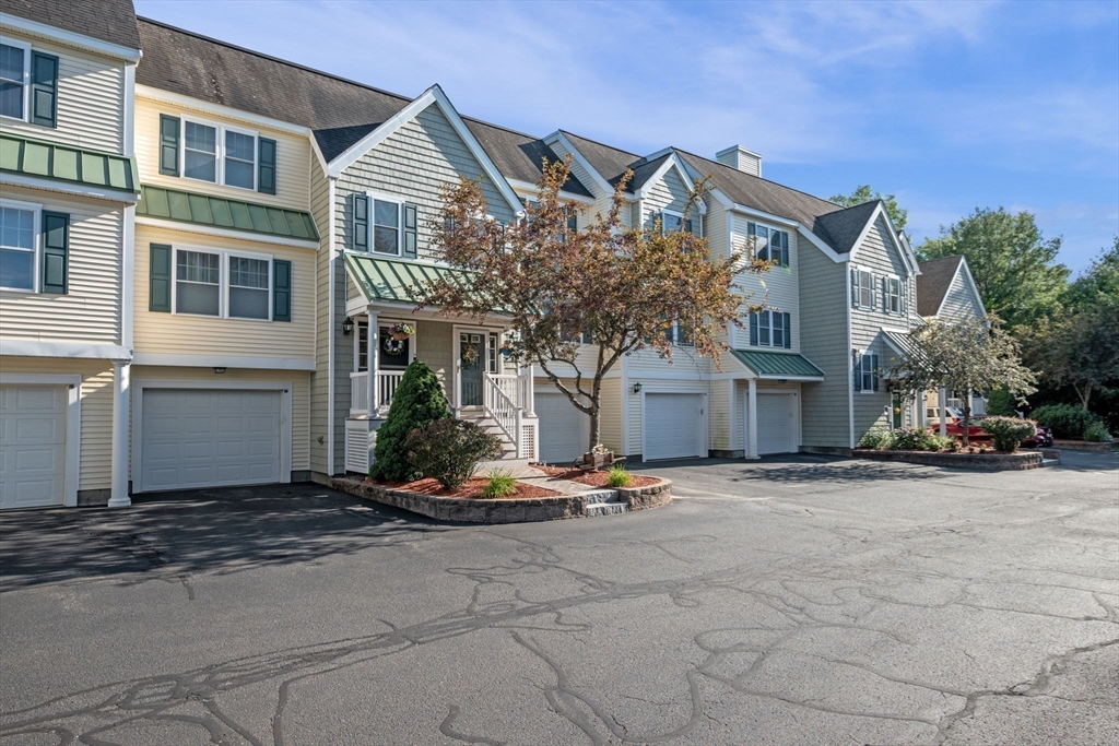 35 Collins Street, Unit 73 Danvers, MA 01923 - Photo 29 of 30 a front view of a house with a yard