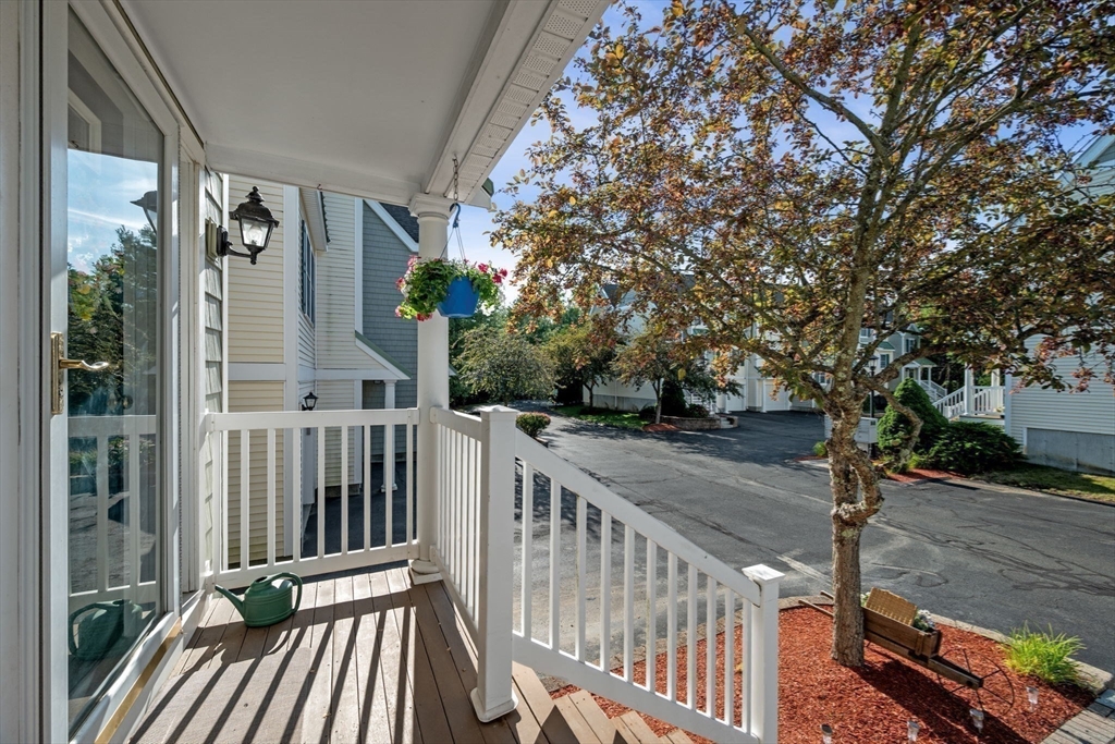 35 Collins Street, Unit 73 Danvers, MA 01923 - Photo 3 of 30 a view of a balcony with wooden floor
