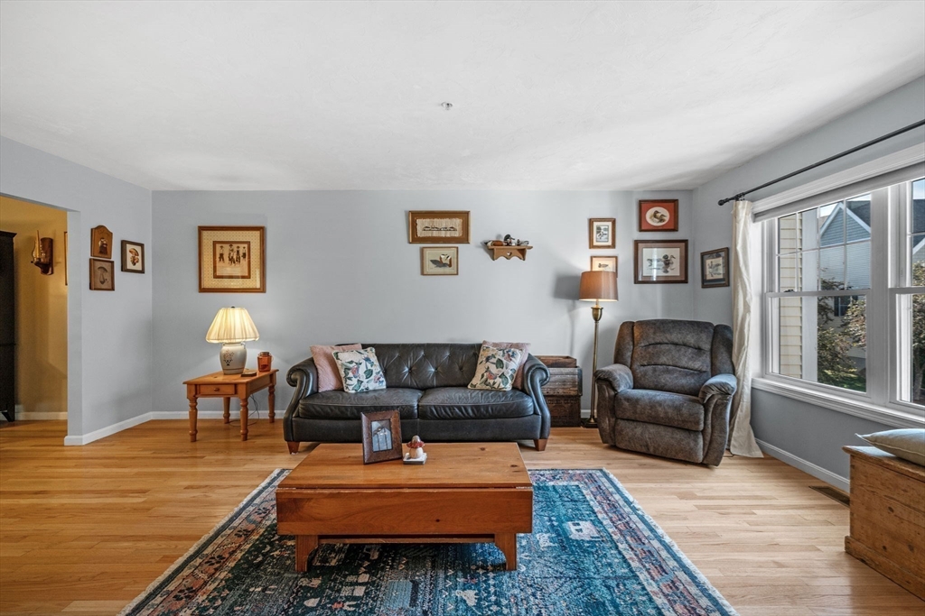 35 Collins Street, Unit 73 Danvers, MA 01923 - Photo 5 of 30 a living room with furniture and a wooden floor