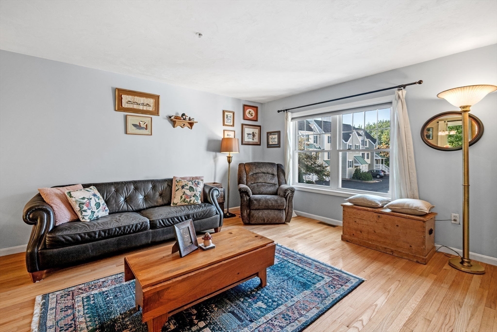 35 Collins Street, Unit 73 Danvers, MA 01923 - Photo 6 of 30 a living room with furniture a rug and a window