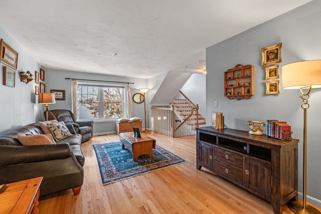 35 Collins Street, Unit 73 Danvers, MA 01923 - Photo 9 of 30 a living room with furniture and a window
