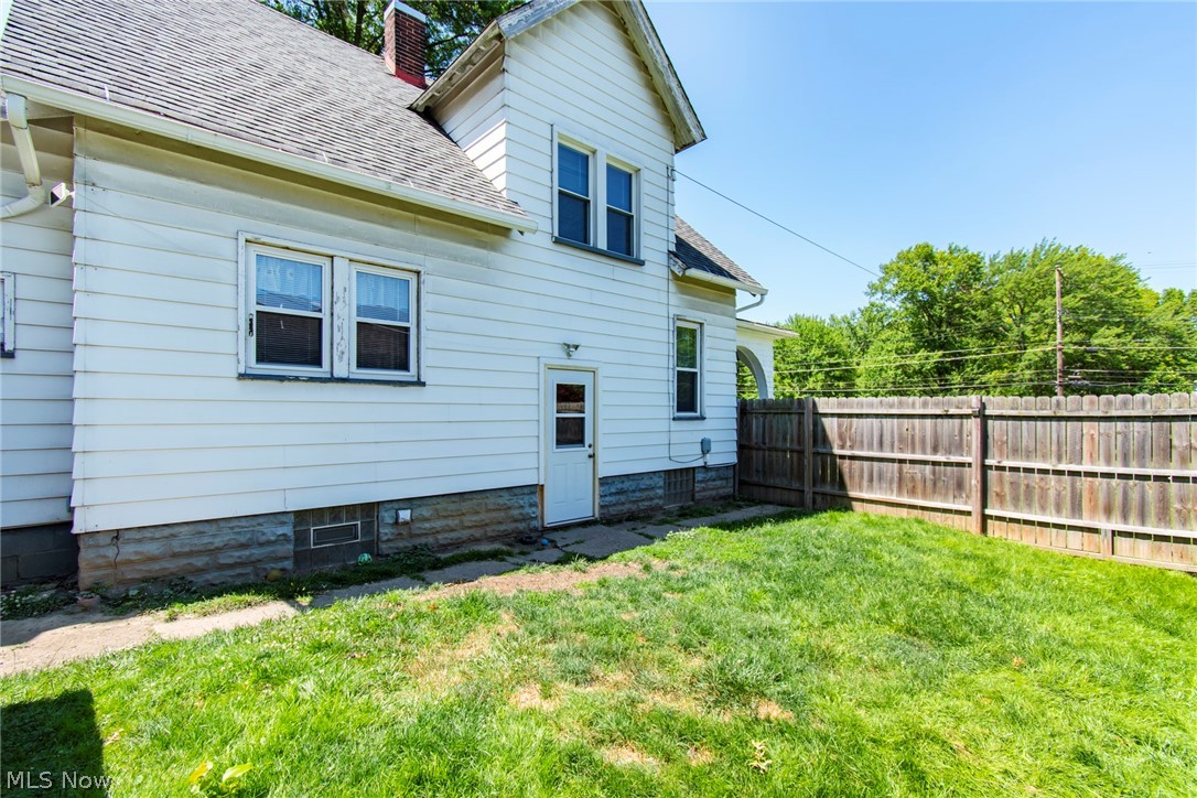 1690 Salt Springs Road Mineral Ridge, OH 44440 - Photo 20 of 21 Back of house with a yard
