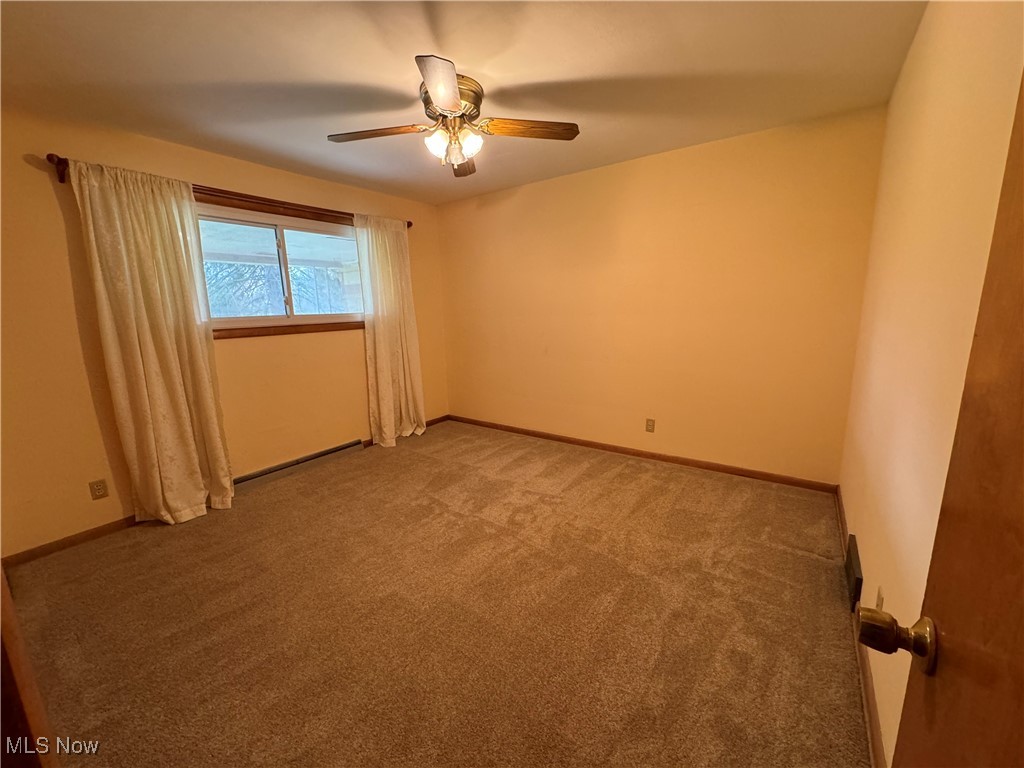 3115 Echo Hills Road Akron, OH 44333 - Photo 14 of 33 Bedroom with neutral carpet and ceiling fan