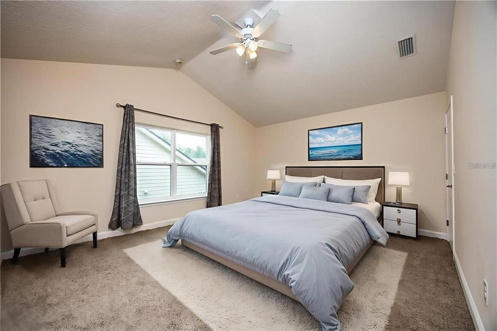8216 Northwest 54th Street Gainesville, FL 32653 - Photo 47 of 58 a bedroom with a large bed couch and a window