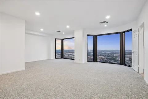 a view of an empty room with a balcony