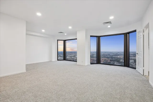 a view of an empty room with a balcony