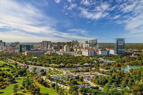 an aerial view of a house with pool outdoor seating and yard
