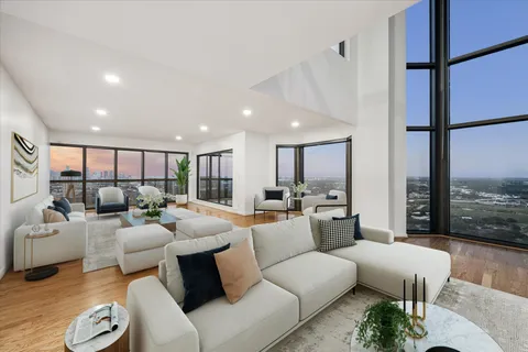 a living room with furniture or outdoor view and a large window