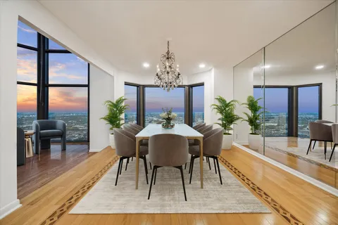 a view of a dining room with furniture window and wooden floor