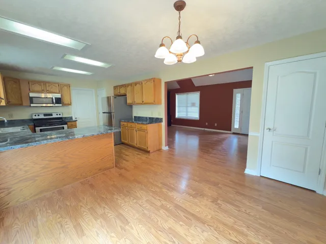 a view of a livingroom with a kitchen