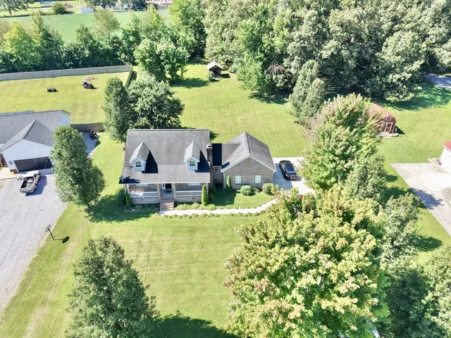 a view of a swimming pool with a yard