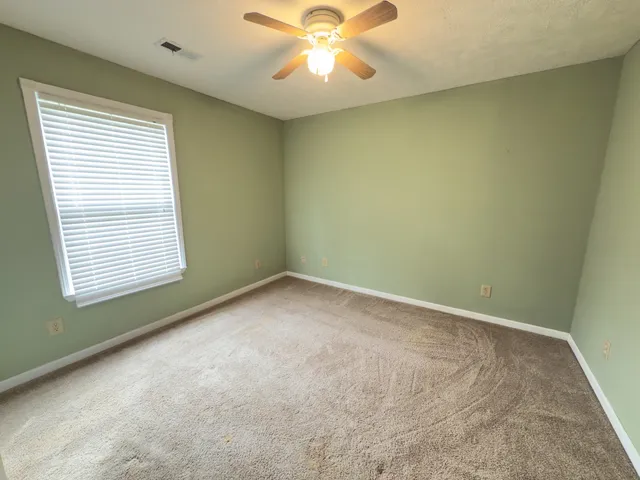 a kitchen with granite countertop cabinets and white appliances