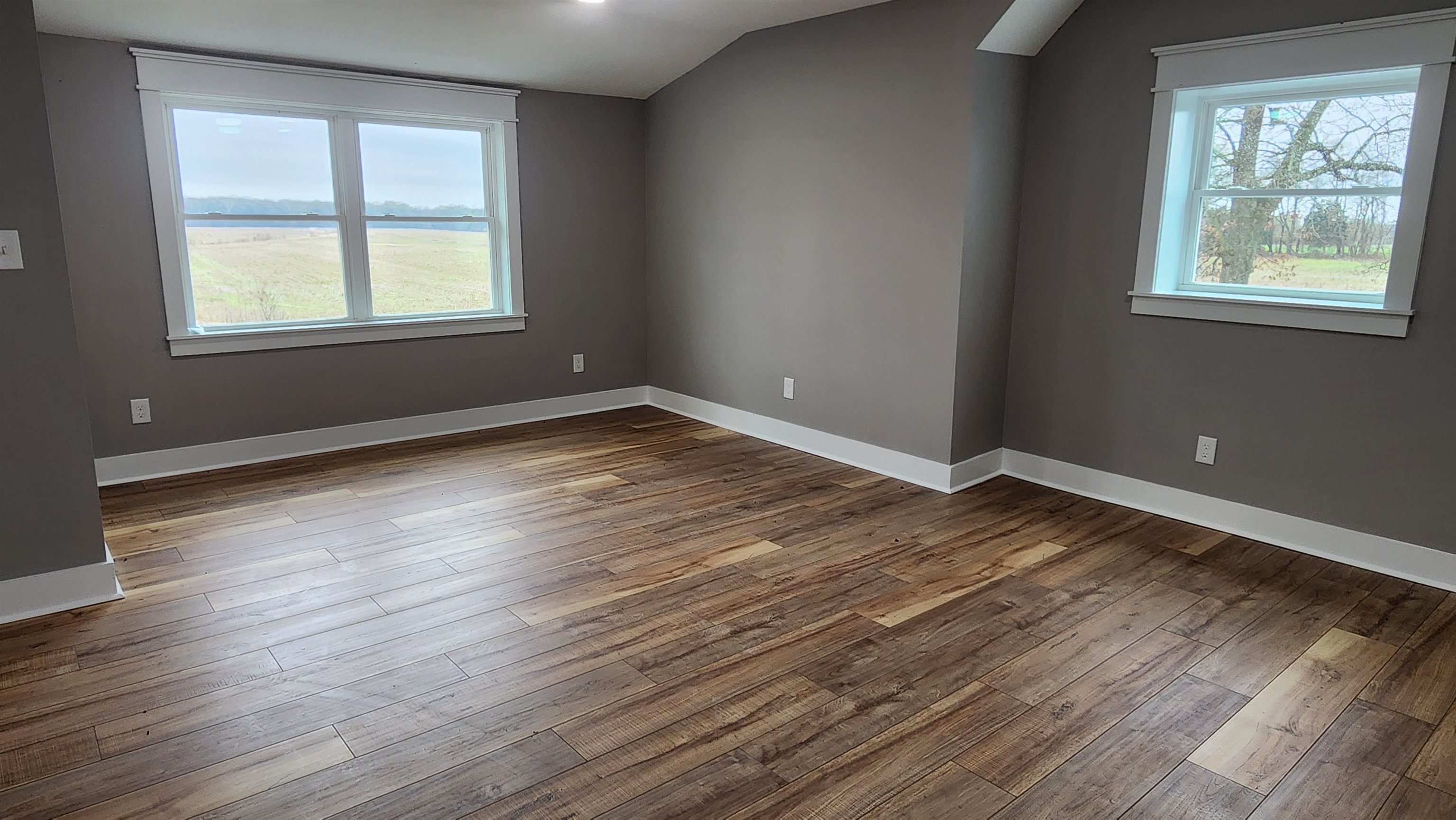 5200 Durhamville Road Ripley, TN 38063 - Photo 14 of 18 a view of an empty room with wooden floor and a window