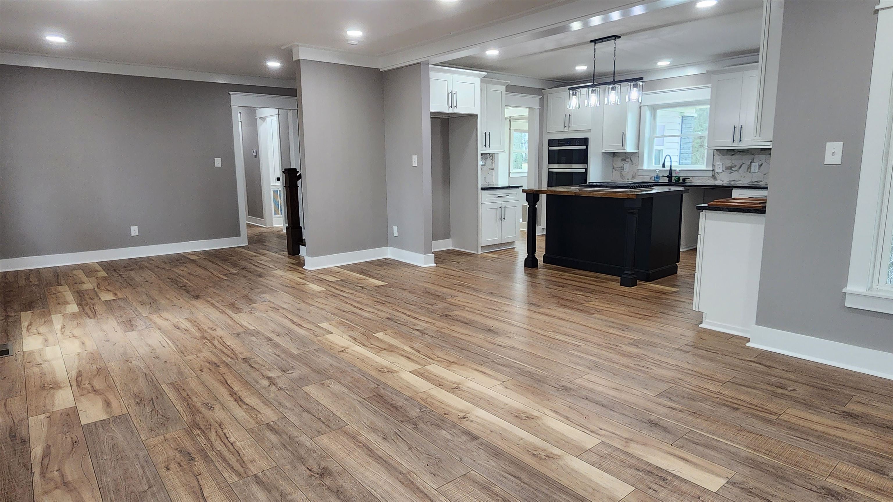 5200 Durhamville Road Ripley, TN 38063 - Photo 2 of 18 a view of kitchen with stainless steel appliances granite countertop a stove top oven a sink and a refrigerator