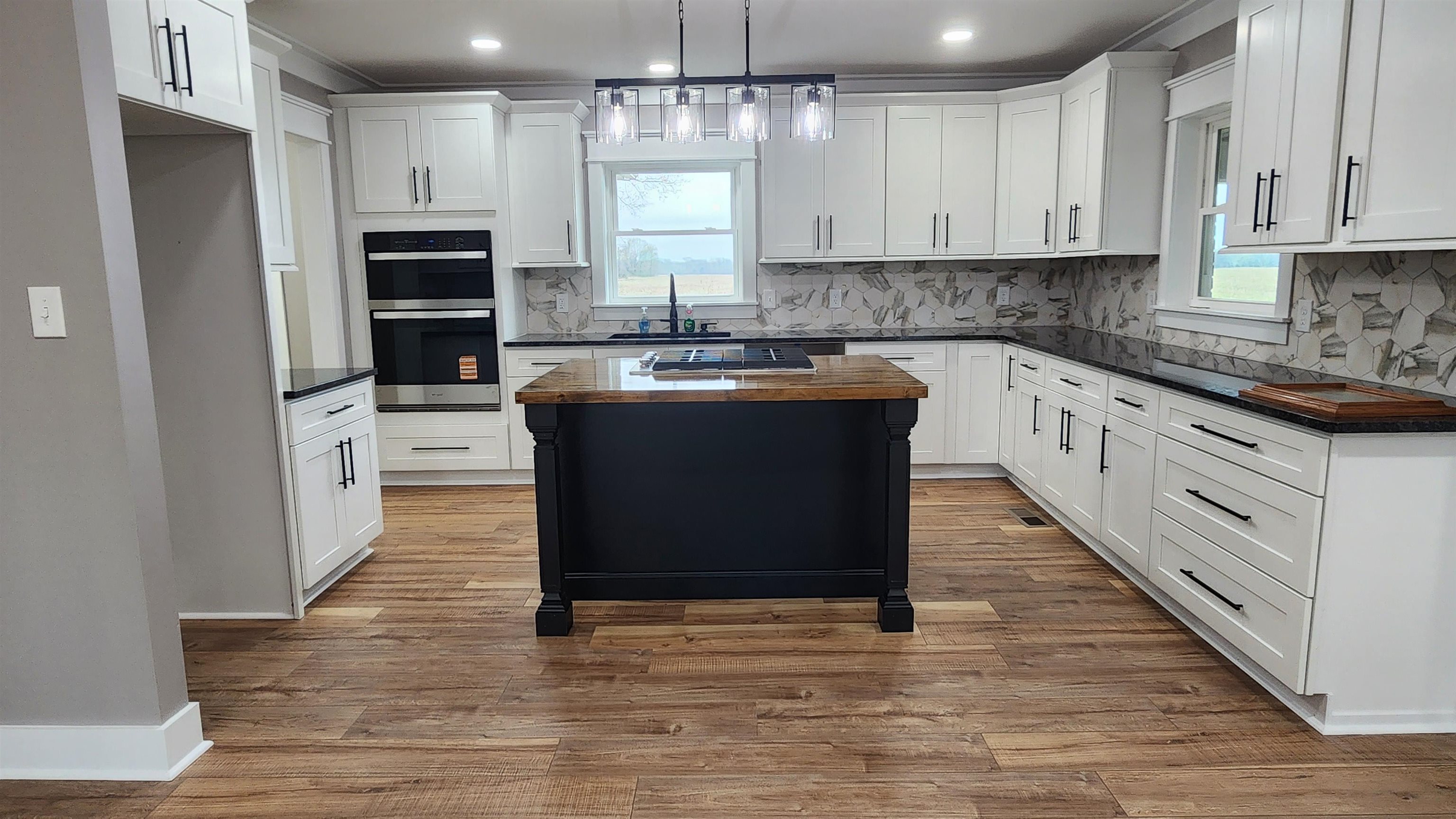 5200 Durhamville Road Ripley, TN 38063 - Photo 3 of 18 a kitchen with stainless steel appliances granite countertop a refrigerator and a stove top oven