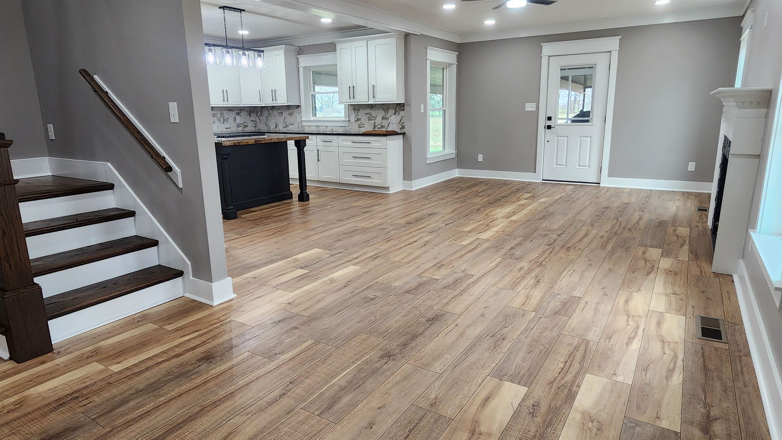 5200 Durhamville Road Ripley, TN 38063 - Photo 4 of 18 a kitchen with granite countertop a sink and a stove top oven