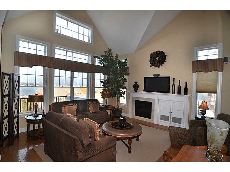297 Village Road, Unit 35 Tiverton, RI 02878 - Photo 3 of 25 Living Room. 2 story with hardwood floors and gas fireplace