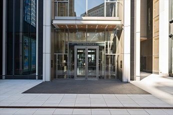 133 Seaport Boulevard, Unit 1017 Boston, MA 02210 - Photo 2 of 28 a front view of a house with a garage