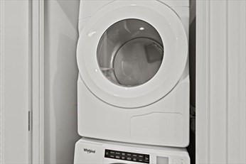133 Seaport Boulevard, Unit 1017 Boston, MA 02210 - Photo 21 of 28 a close up view of a washer and dryer