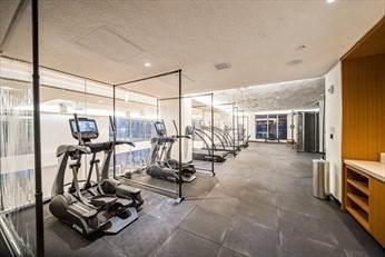 133 Seaport Boulevard, Unit 1017 Boston, MA 02210 - Photo 23 of 28 a view of a room with gym equipment