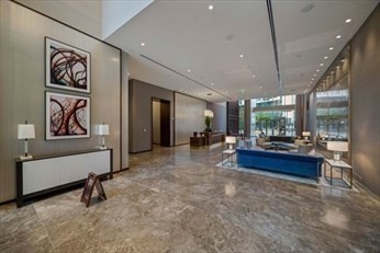 133 Seaport Boulevard, Unit 1017 Boston, MA 02210 - Photo 4 of 28 a lobby with furniture and a rug