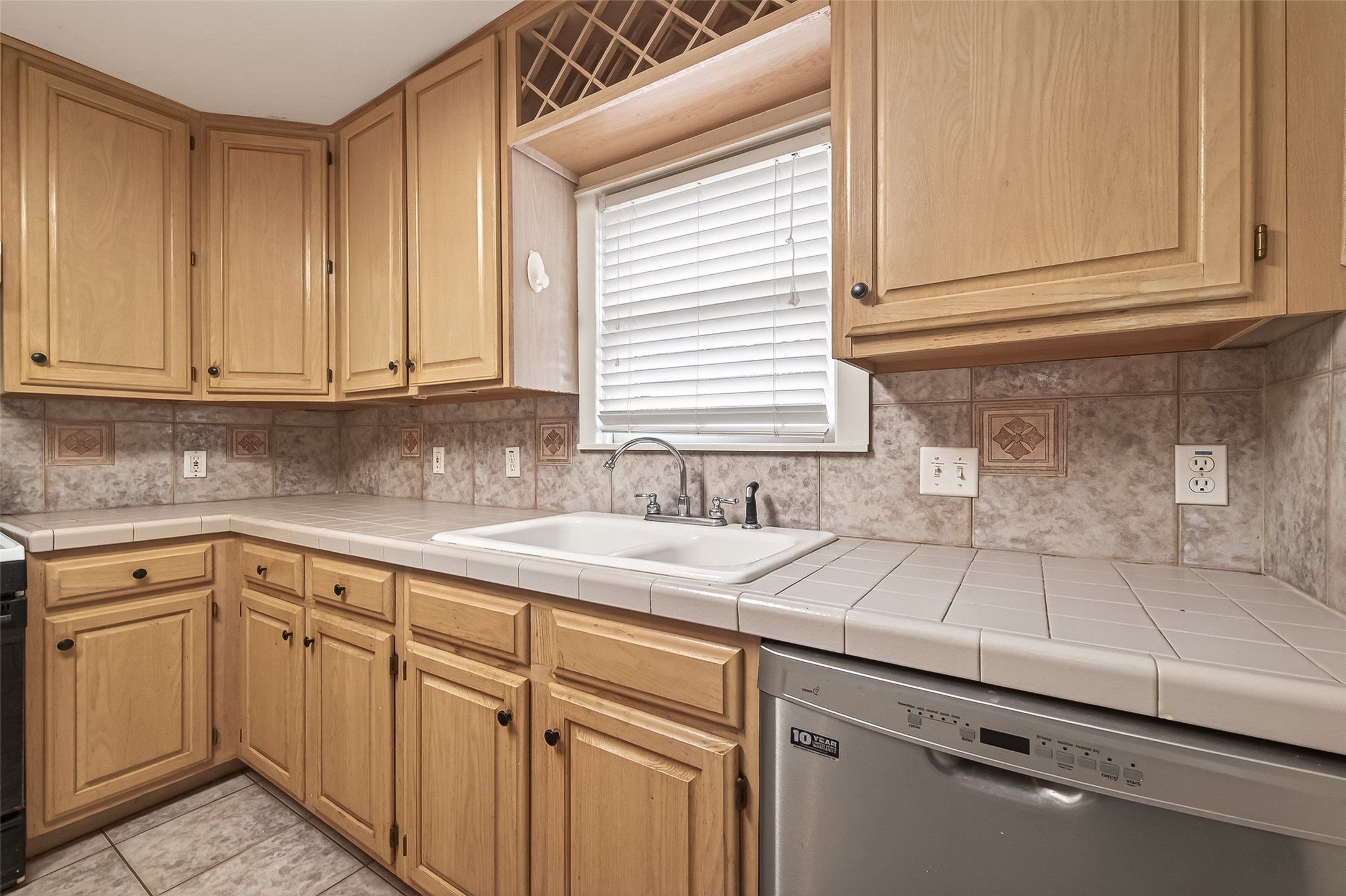 1807 Crocker Street, Unit A Houston, TX 77006 - Photo 12 of 37 a kitchen with a sink cabinets and window