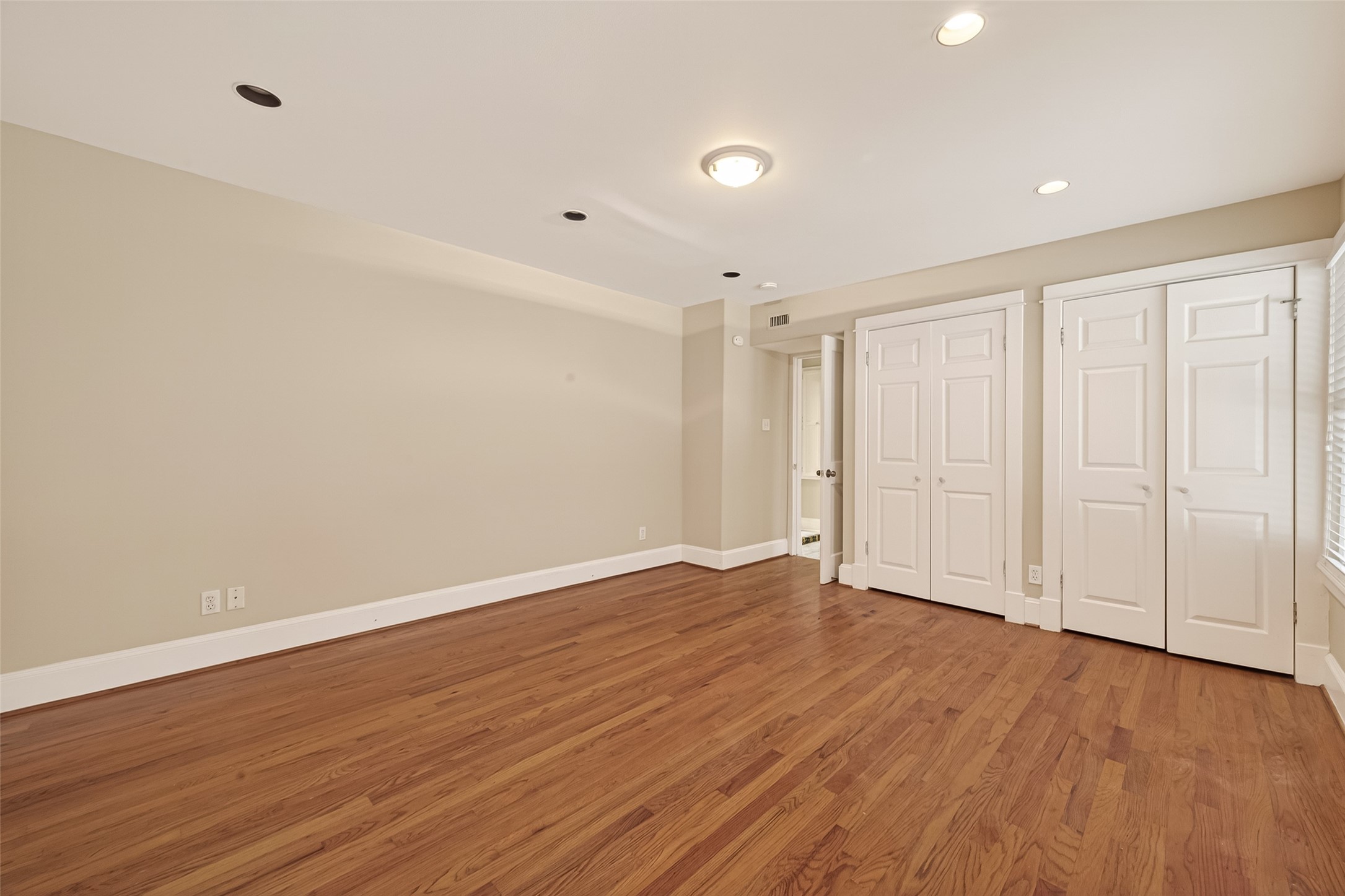 1807 Crocker Street, Unit A Houston, TX 77006 - Photo 19 of 37 a view of an empty room with wooden floor