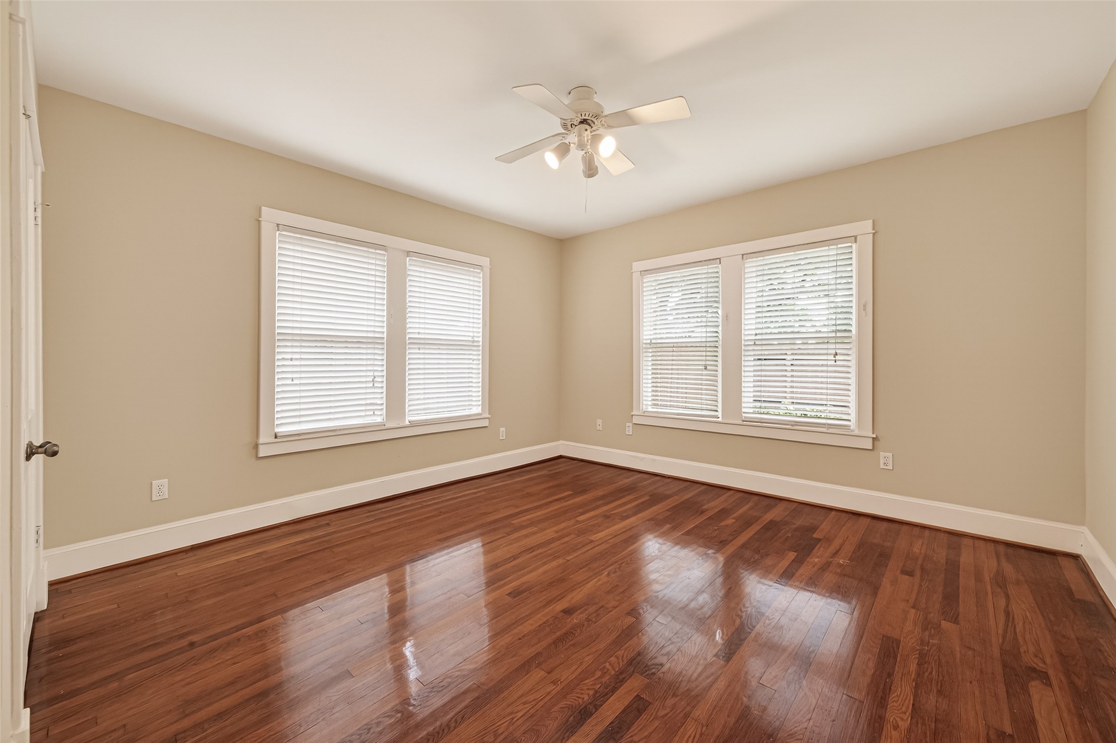 1807 Crocker Street, Unit A Houston, TX 77006 - Photo 23 of 37 a view of an empty room with wooden floor and a window