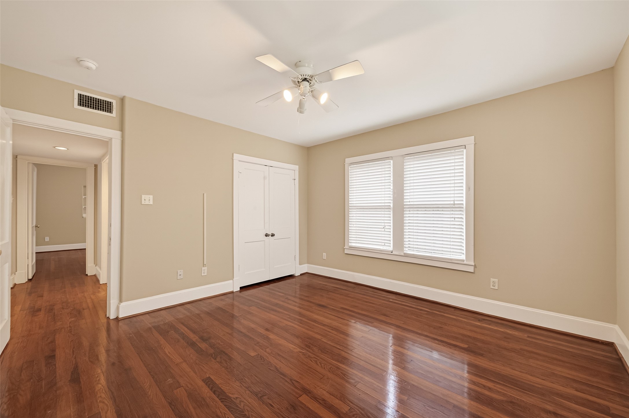 1807 Crocker Street, Unit A Houston, TX 77006 - Photo 24 of 37 a view of an empty room with wooden floor and a window