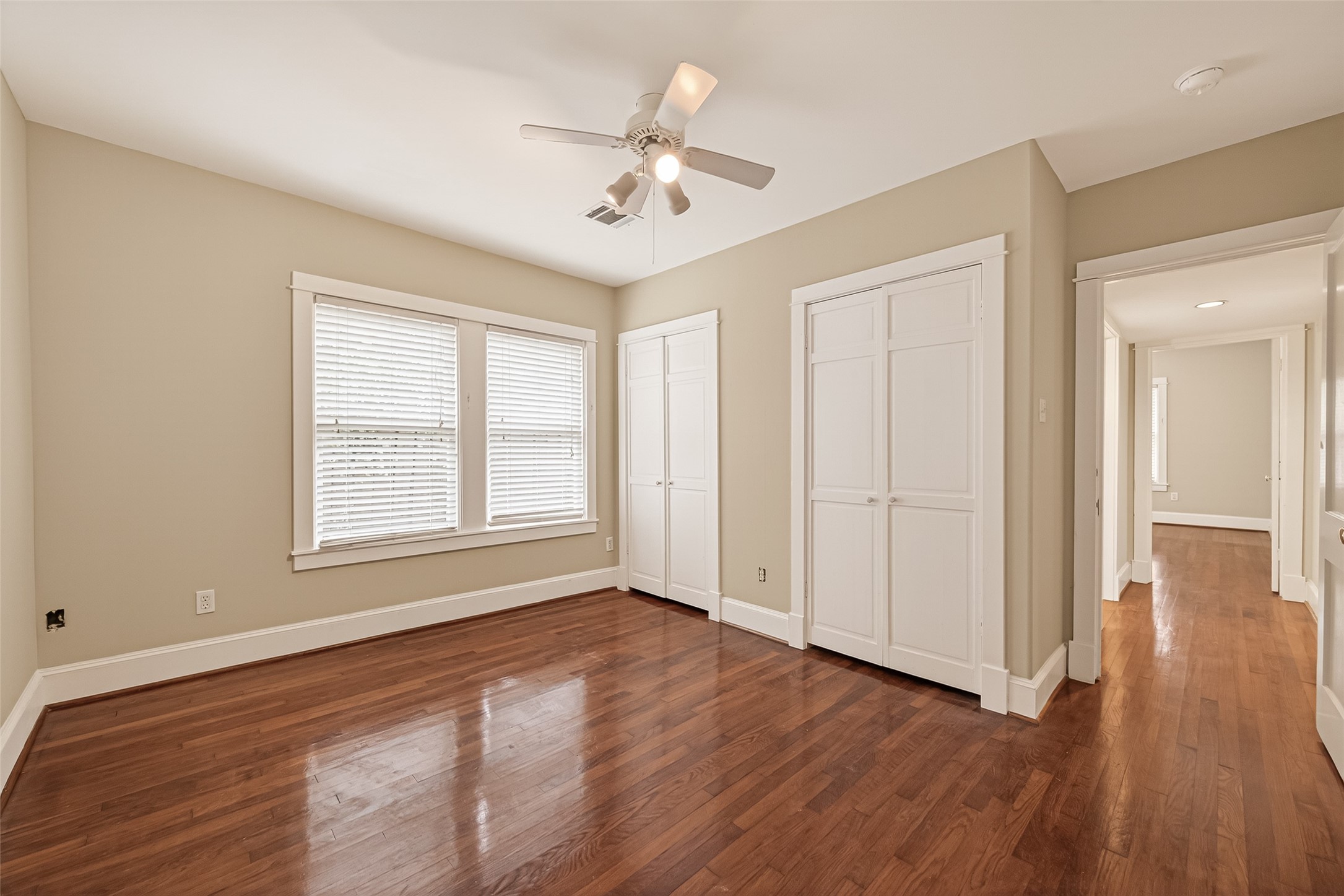 1807 Crocker Street, Unit A Houston, TX 77006 - Photo 29 of 37 a view of an empty room with wooden floor and a window