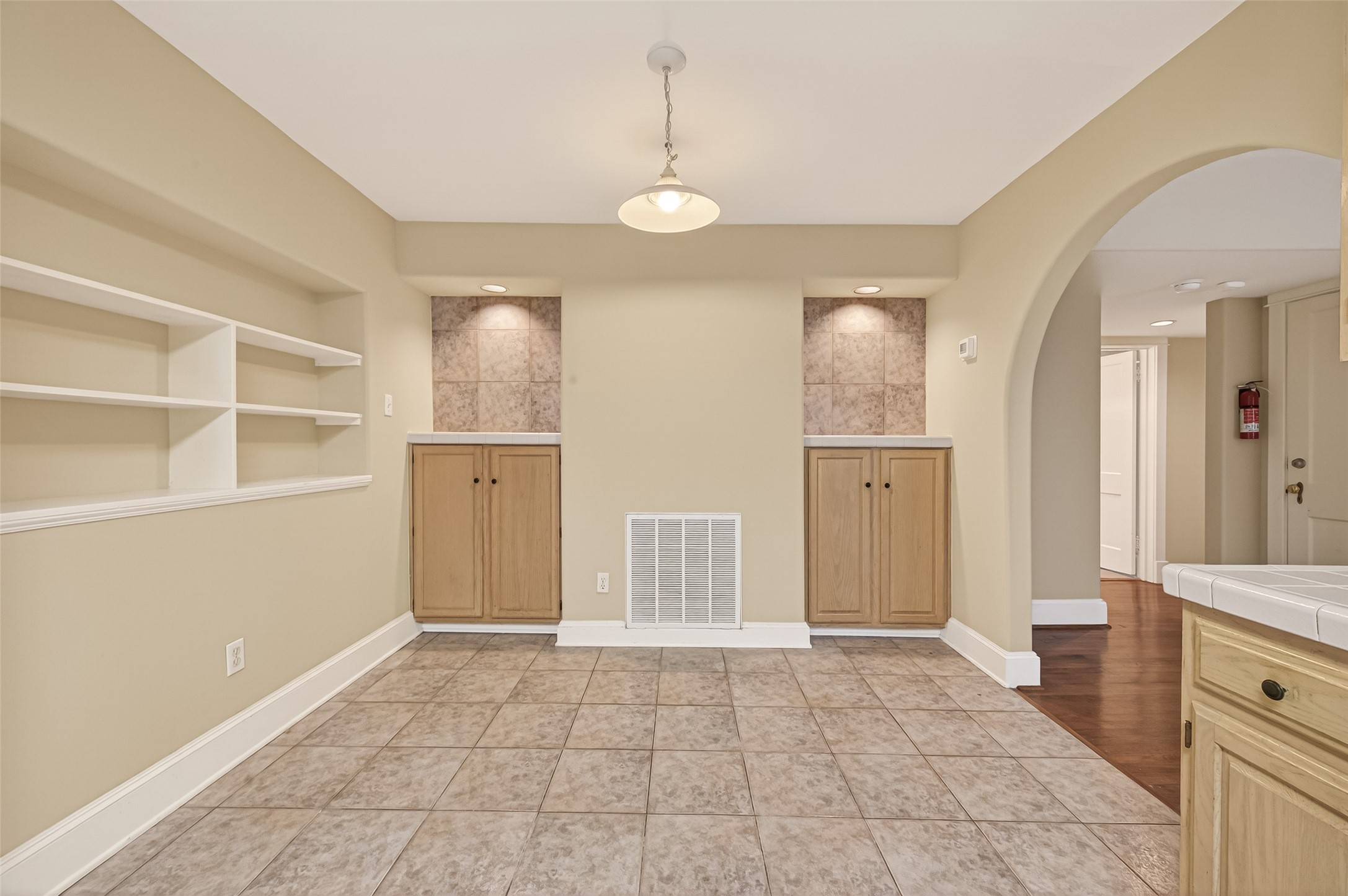 1807 Crocker Street, Unit A Houston, TX 77006 - Photo 10 of 37 This end is a great spot for dining table. The storage cabinets at the end of the room come in handy, and so do the bookshelves on the left!