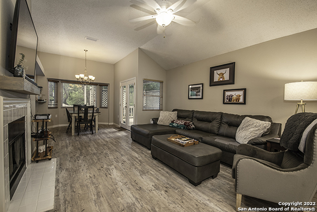 16807 Cedar Tree Way San Antonio, TX 78247 - Photo 11 of 30 a living room with furniture and a fireplace