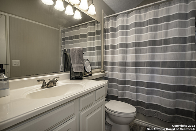 16807 Cedar Tree Way San Antonio, TX 78247 - Photo 14 of 30 a bathroom with a sink and a mirror