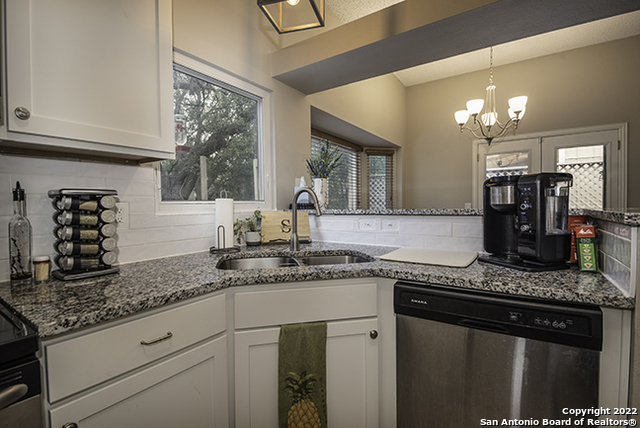 16807 Cedar Tree Way San Antonio, TX 78247 - Photo 2 of 30 a kitchen with stainless steel appliances granite countertop a sink stove and cabinets